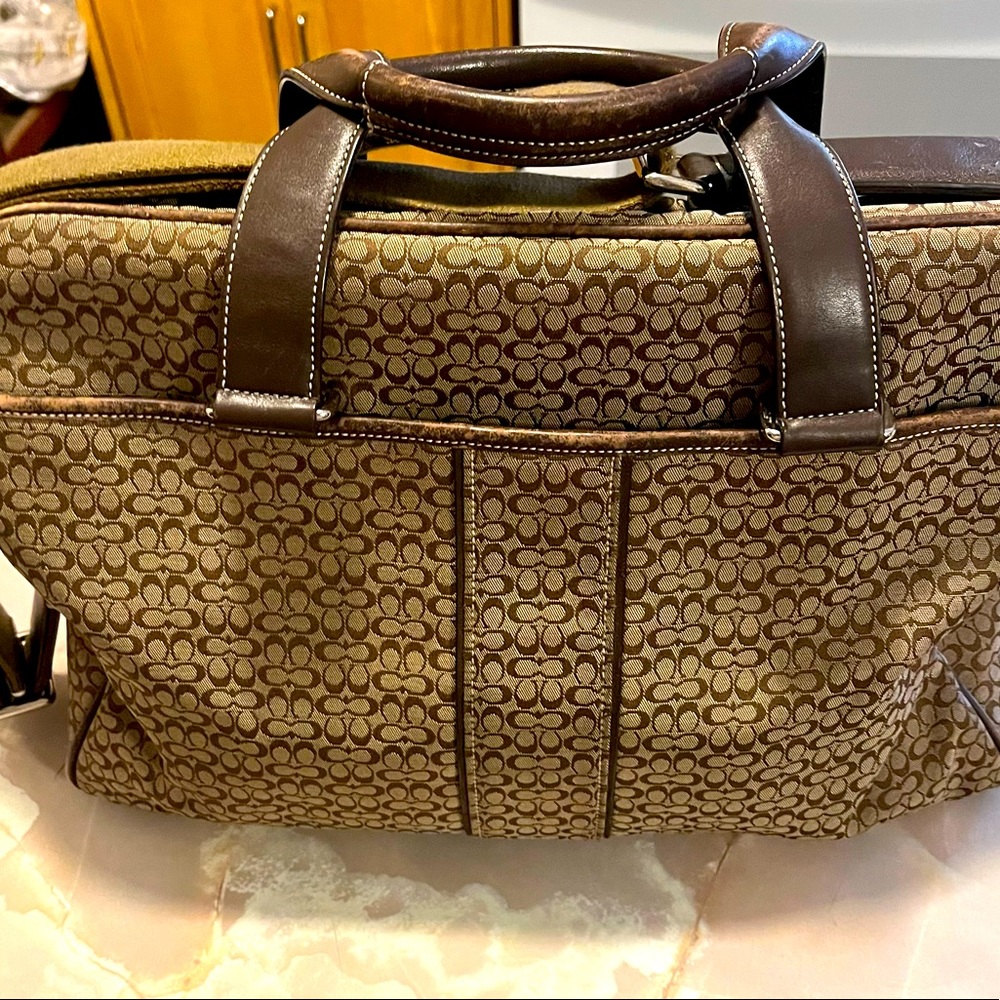 Very nice brown Coach brief case bag. Very mild wear.